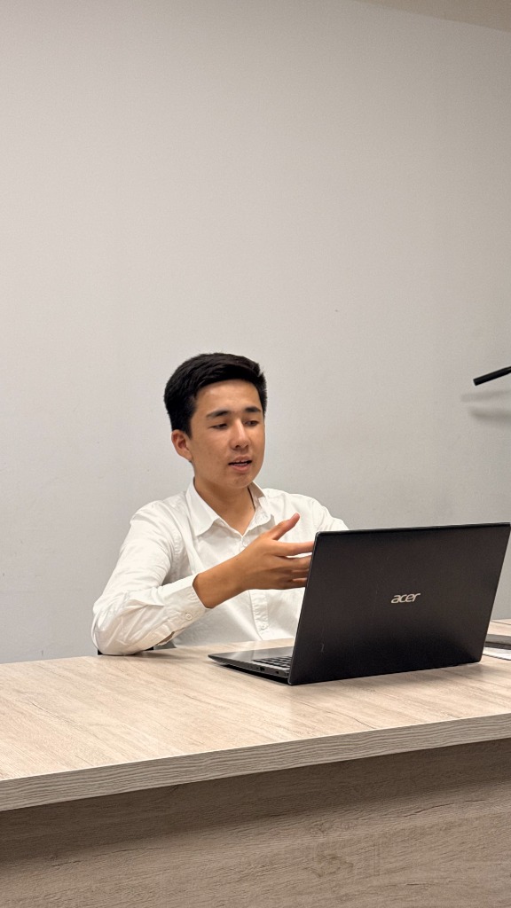 Ismat Ismoilov working at his desk